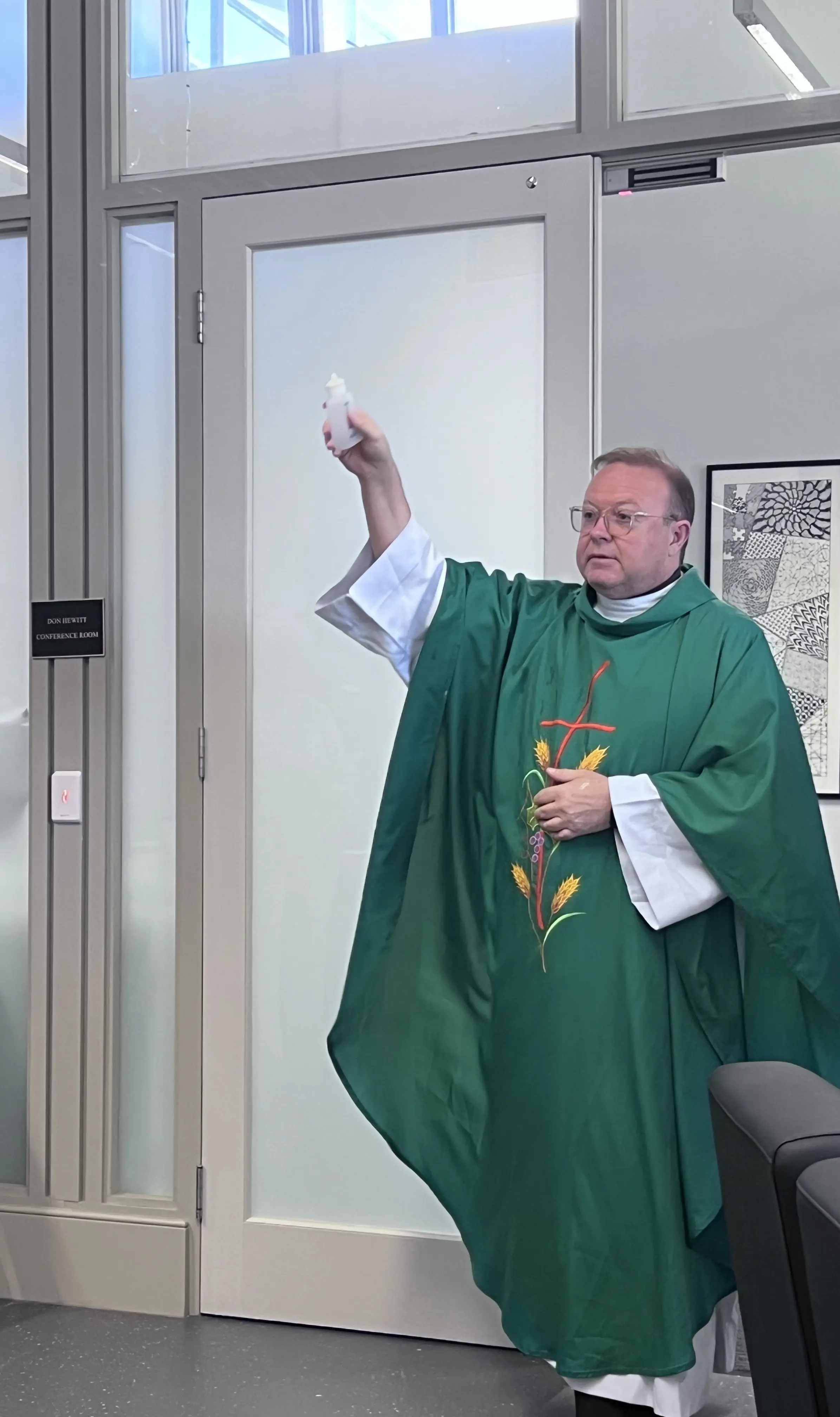 Fr Damien blesses the entrance of the new Conference Room